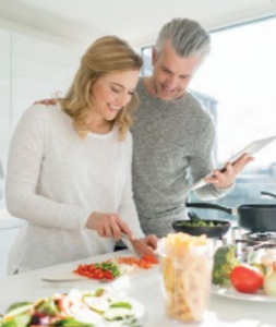 cooking-fresh-healthy-food man and woman cooking in kitchen
