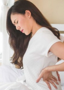 woman-experiencing-back-pain-during-pregnancy woman holding back in pain